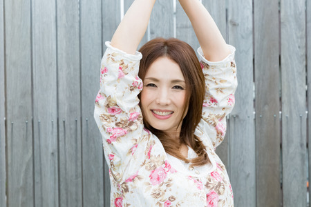 Lady in nightwear stretching outsideの写真素材