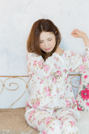 Lady with pain in back of neckの写真素材