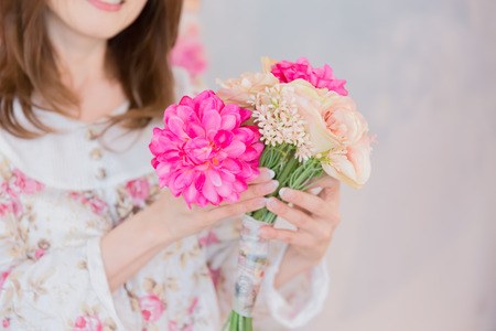 Lady holding bouquetの写真素材