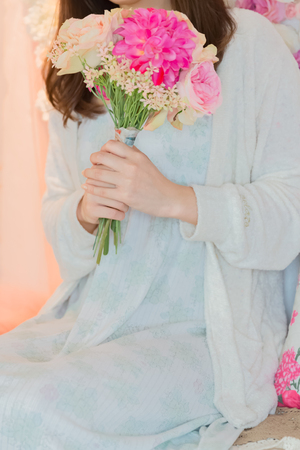 Lady holding bouquetの写真素材