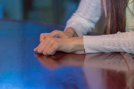 Lady waiting at bar counterの写真素材