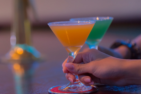 Cocktail glasses at bar counterの写真素材