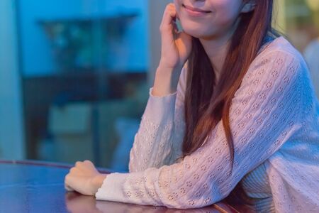 Lady waiting at bar counterの写真素材