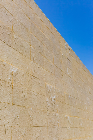 Stone wall with blue skyの写真素材