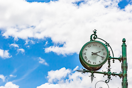Clock in sky with cloudの写真素材