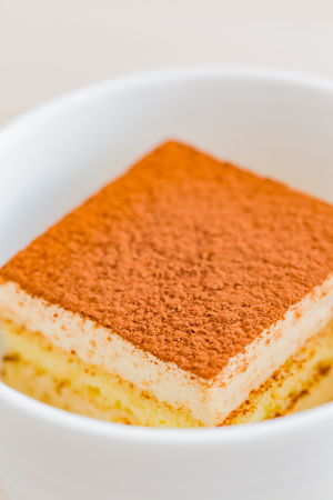 tiramisu cake in white cupの写真素材