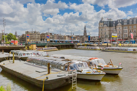 tour boat on canal in amsterdamのeditorial素材