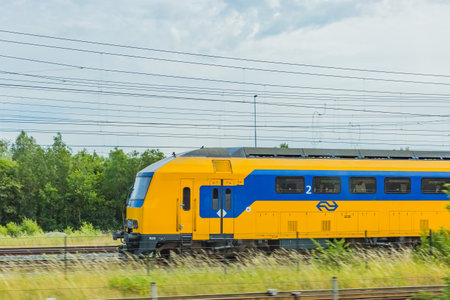 yellow dutch train in netherlandsのeditorial素材