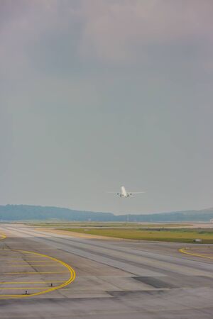 airplane taking off at airportの写真素材