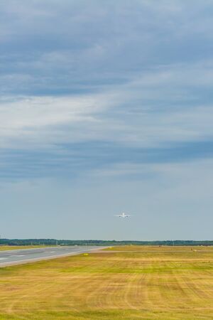 airplane taking off at airportの写真素材