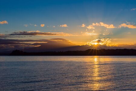 Calbuco volcanoand and Llanquihue lake in Chile at sun riseの写真素材