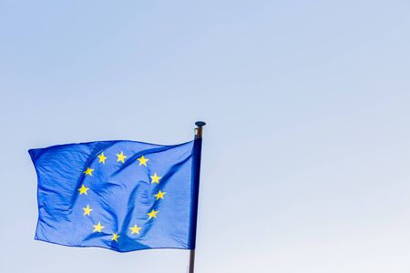 european union flag on blue sky backgroundの写真素材