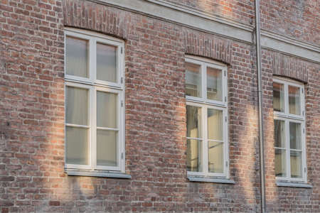 brick wall with window of norwegian house