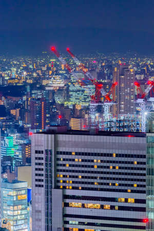 Osaka castle night view from sky buildingの写真素材