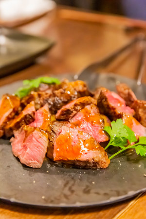grilled sliced beef steak on plateの写真素材