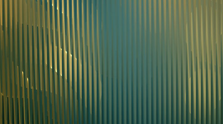 A visually striking abstract background with vertical lines in green and gold tones, creating a textured surface. Ideal for adding a touch of elegance to designs.の写真素材