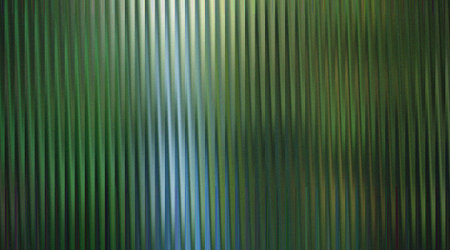 A striking abstract background featuring green vertical lines, creating a textured surface with a modern and dynamic feel. Perfect for adding depth and visual interest.の写真素材
