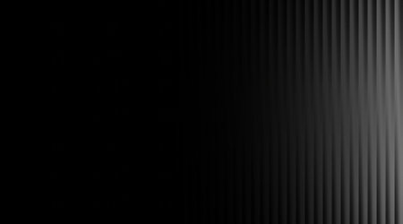 A visually appealing monochrome abstract background featuring vertical lines in black and gray, creating a modern and elegant effect. Perfect for various projects.の写真素材