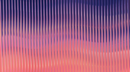 A visually striking backdrop featuring vertical lines in a gradient of purple, pink, and blue, perfect for adding a modern and artistic touch to any project.の写真素材