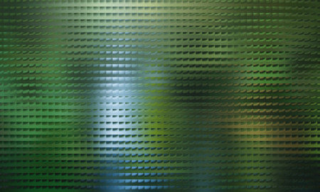 A captivating abstract background featuring a mosaic pattern with a blurred nature view behind a glass surface, creating a unique and visually appealing texture.の写真素材
