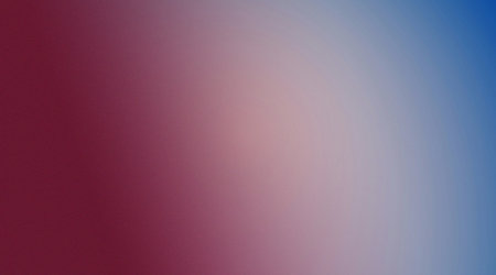 A visually appealing abstract background featuring a smooth gradient transition from deep red on the left to soft pink and then to a bright blue on the right, with a subtle textured surface.の写真素材