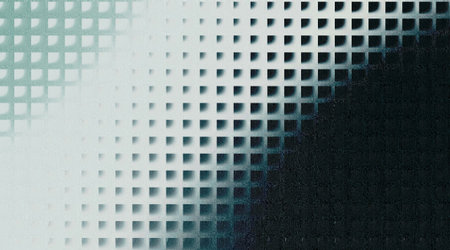 An abstract digital artwork featuring a grid of small squares that transition from a light, almost white hue to a dark, speckled black, creating a dramatic gradient effect.の写真素材