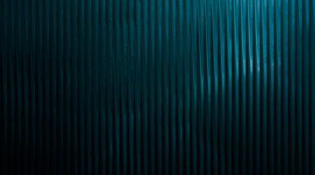A close-up, abstract view of a textured surface featuring vertical, ribbed lines in varying shades of blue and teal, creating a sense of depth and subtle movement.の写真素材