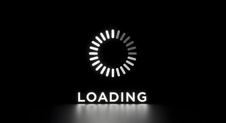 White loading circle with the word loading on a black reflective surfaceの素材