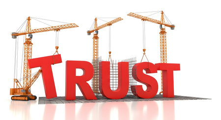 Trust building concept with cranes and large red lettersの素材