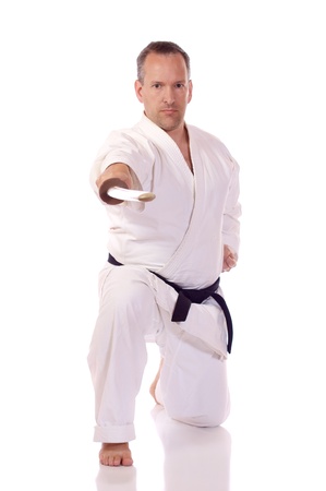 Man in karate-gi holding a bokenの写真素材