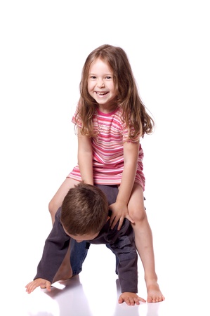 Cute brother and sister playing togetherの写真素材