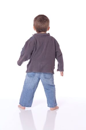 Cute little boy dancing and playingの写真素材