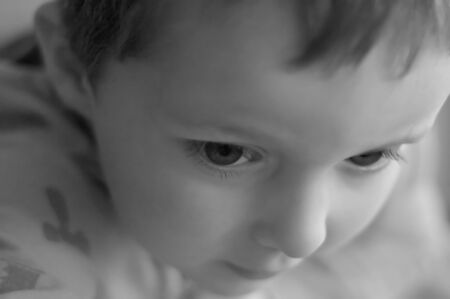 Sad and lonely little boyの写真素材