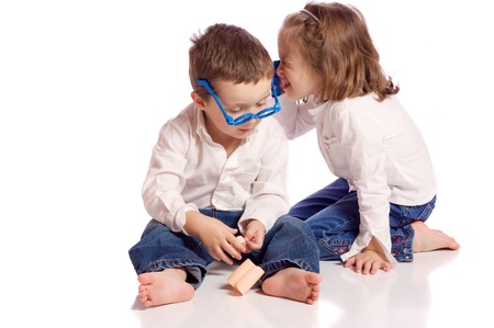 Cute little brother and sister playing doctorの写真素材