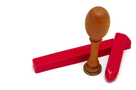 Signet stamped in red wax and gold ink to seal a parchment envelopeの写真素材