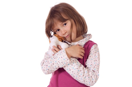 Cute little girl with a toy dogの写真素材