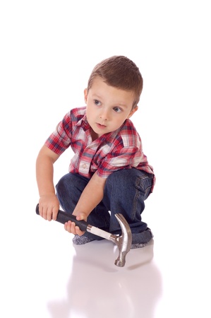 Cute little boy with a hammerの写真素材