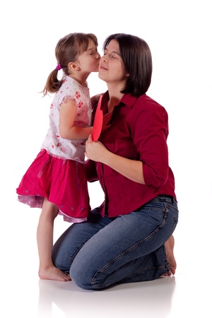 Cute little girl kissing her momの写真素材