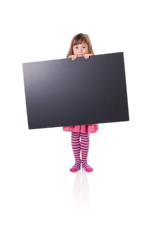Cute little girl holding a blank cardboard signの写真素材