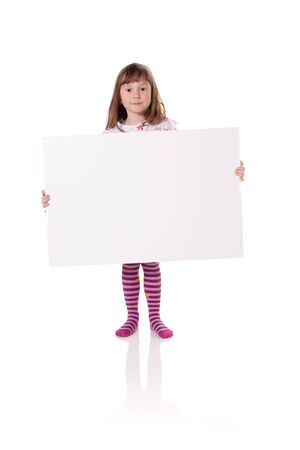 Cute little girl holding a blank cardboard signの写真素材