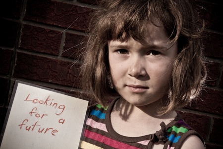 Little girl looking for a futureの写真素材