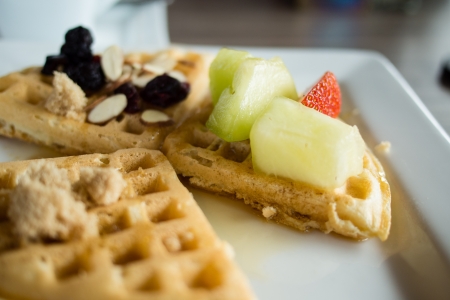 Waffles with fruits and brown sugarの写真素材