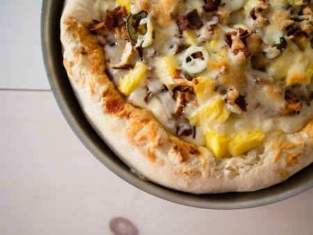Sausage, pineapple and cheese panpizzaの写真素材