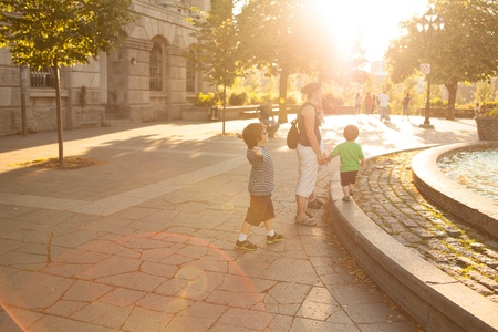 Family walking in downtown Montreal at sunsetの写真素材