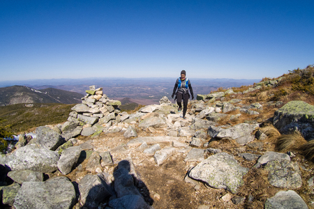 Woman trail running in the White Mountains of New Hampshireの写真素材