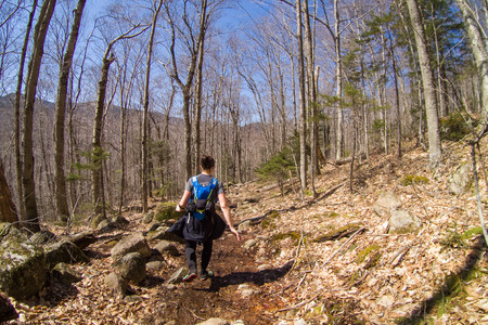 Woman hiking on a trail in early Springの写真素材