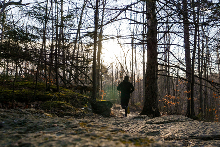Man trail running in the fallの写真素材