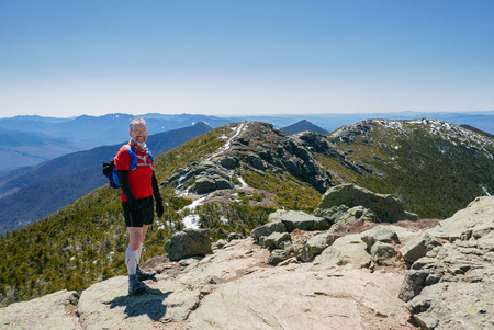 Man trail running in the White Mountains of New Hampshireの写真素材