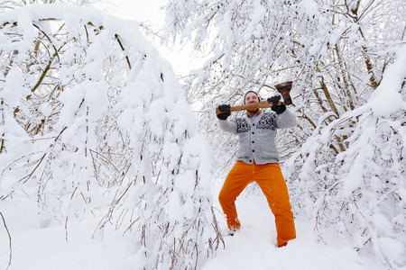 Lumberjack in the snowy winter forestの写真素材