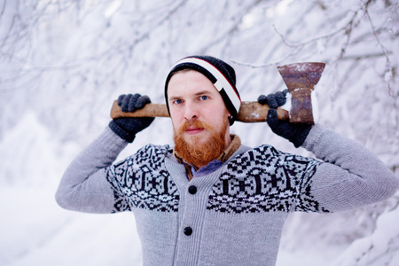 Lumberjack in the snowy winter forestの写真素材